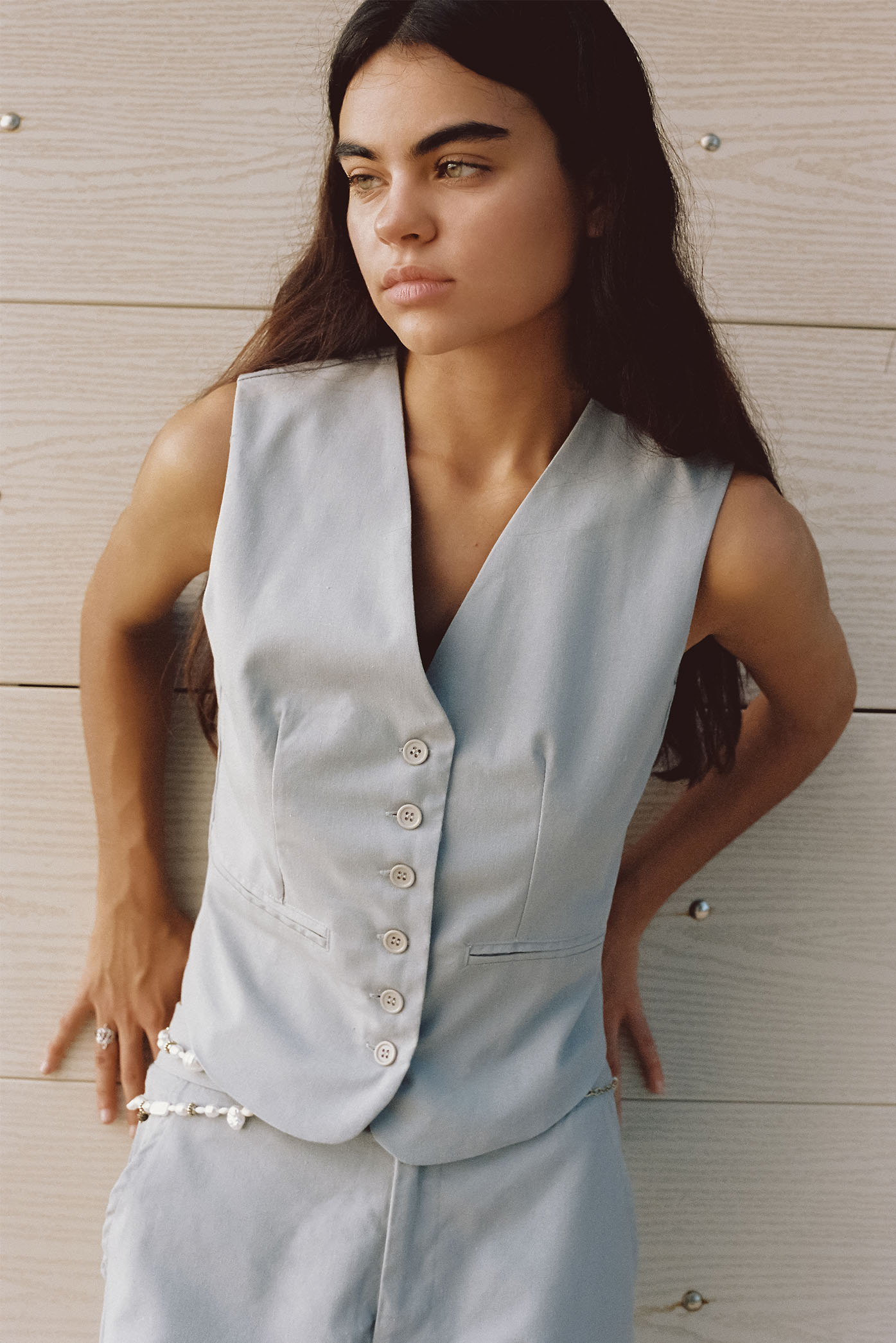 Model wearing the Cleo Grey Vest of the summer 23/24 Matte collection in a beach in Costa Rica.