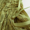 Fabric detail of the "Lace Musgo Stretch" green skirt from the summer 23/24 Matte collection.