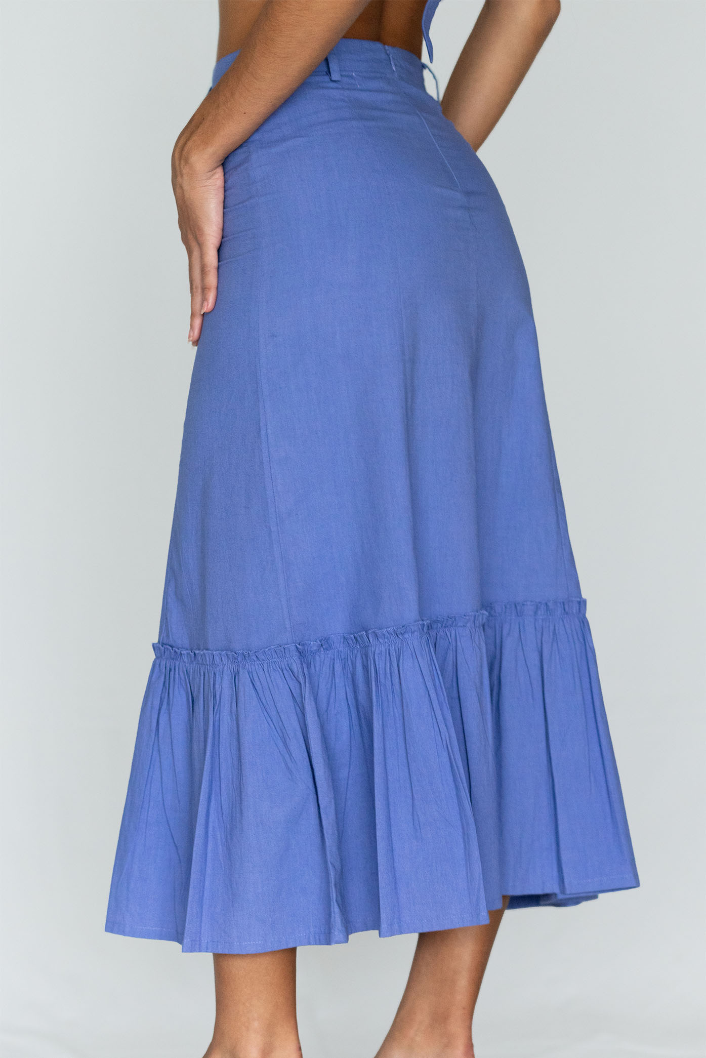 Model showing the back side of the "Violet Maxi Skirt" from the summer 23/24 Matte collection.