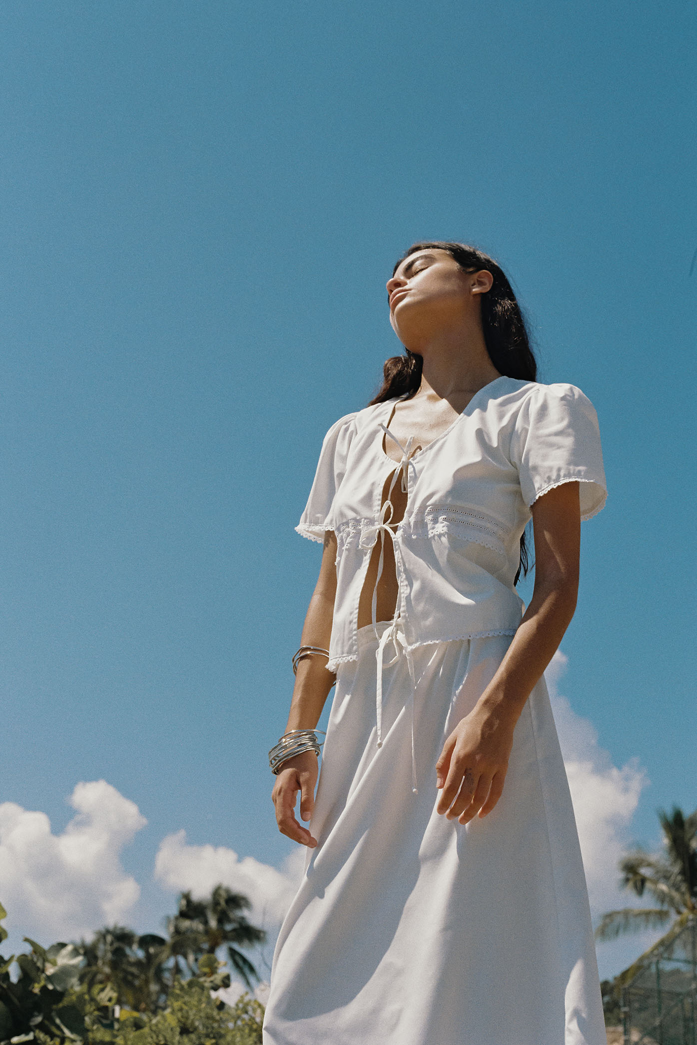 Model wearing the "White Bianca Skirt" from the summer 23/24 Matte collection in a beach in Costa Rica.