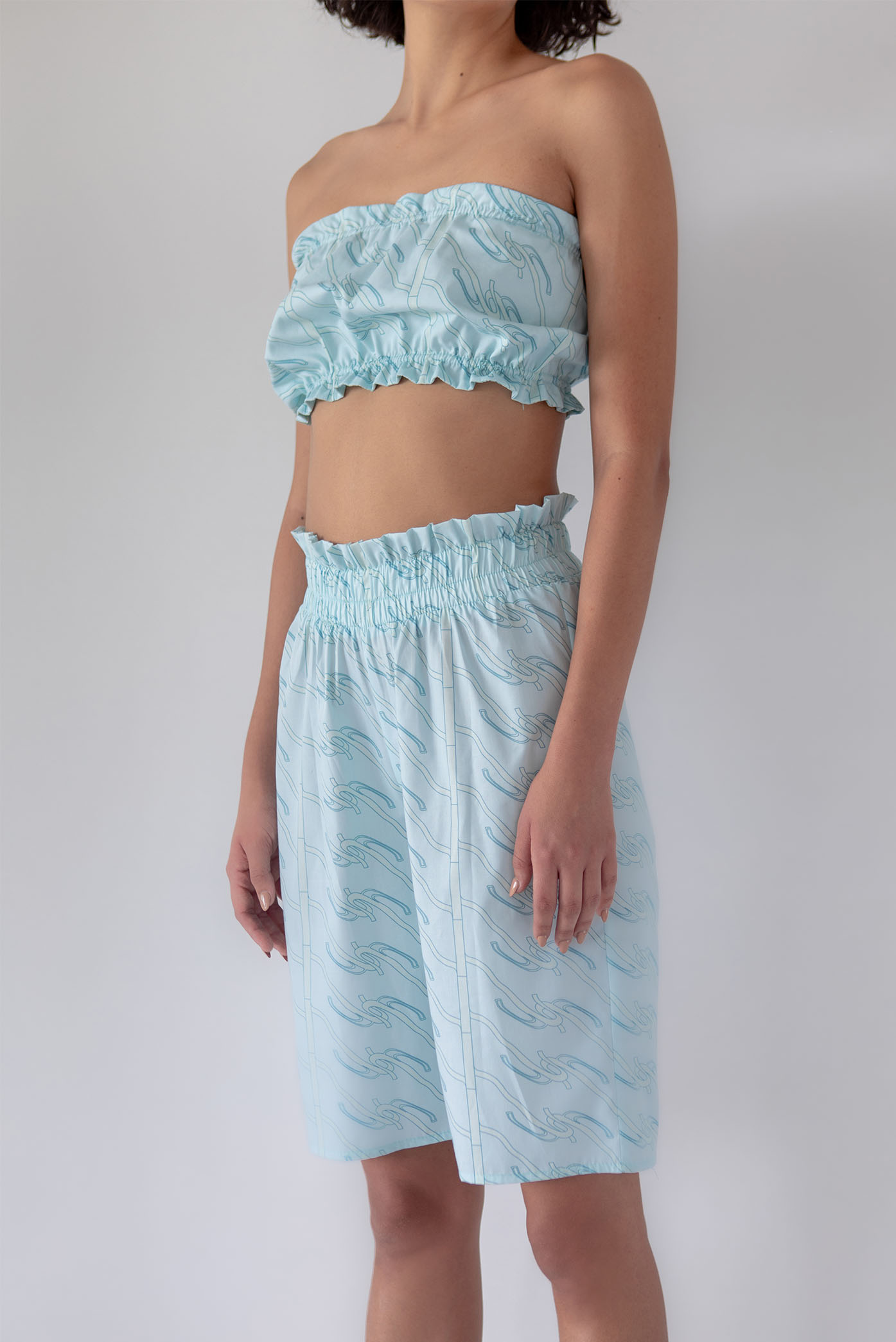 A zoomed-in detail of the Ramona Cotton Light blue printed Long Shorts for the Summer 23/24 Matte Collection.