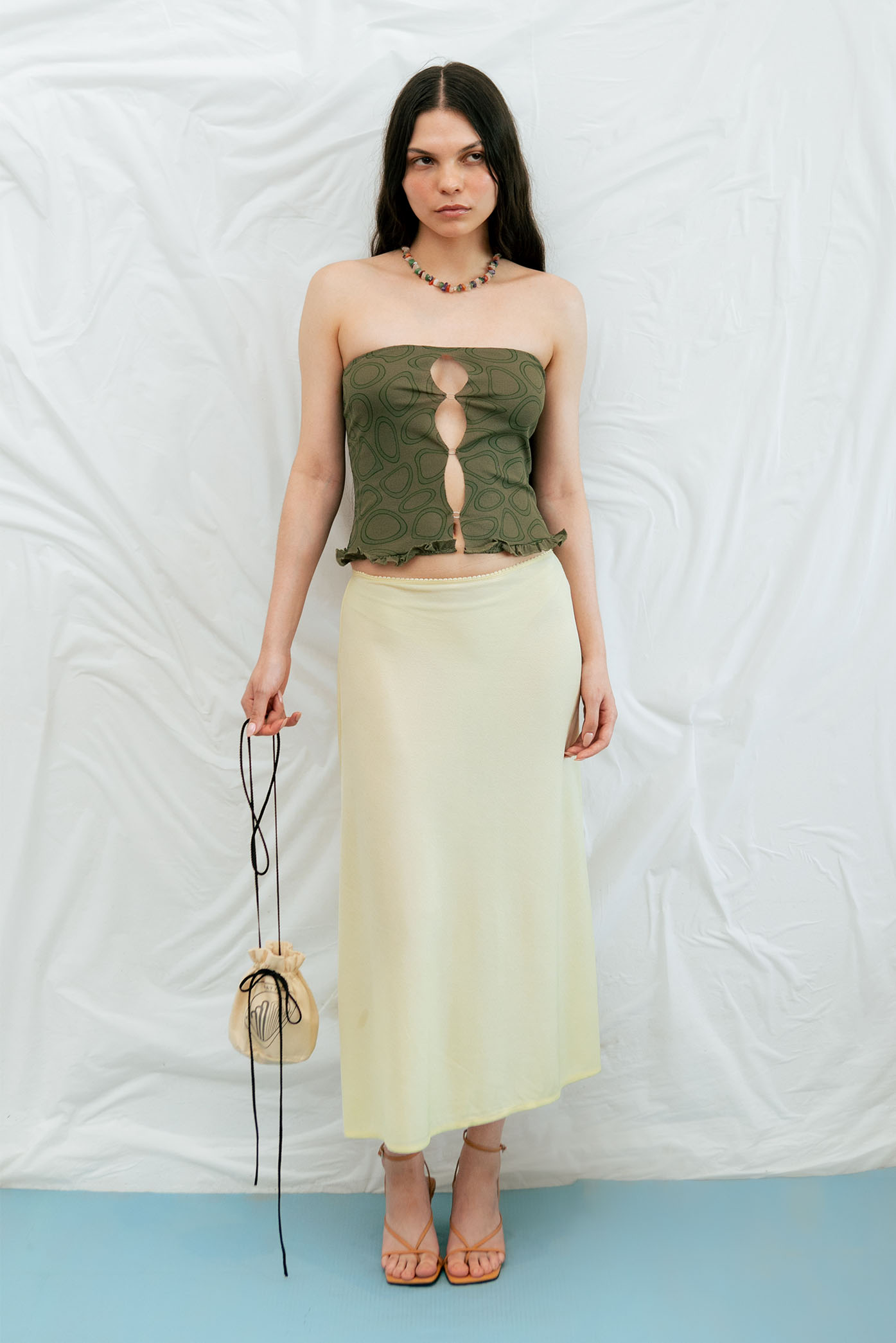 Model showing a full look with the Ring Strapless Printed Top for the Spring Summer 23 Matte Collection.