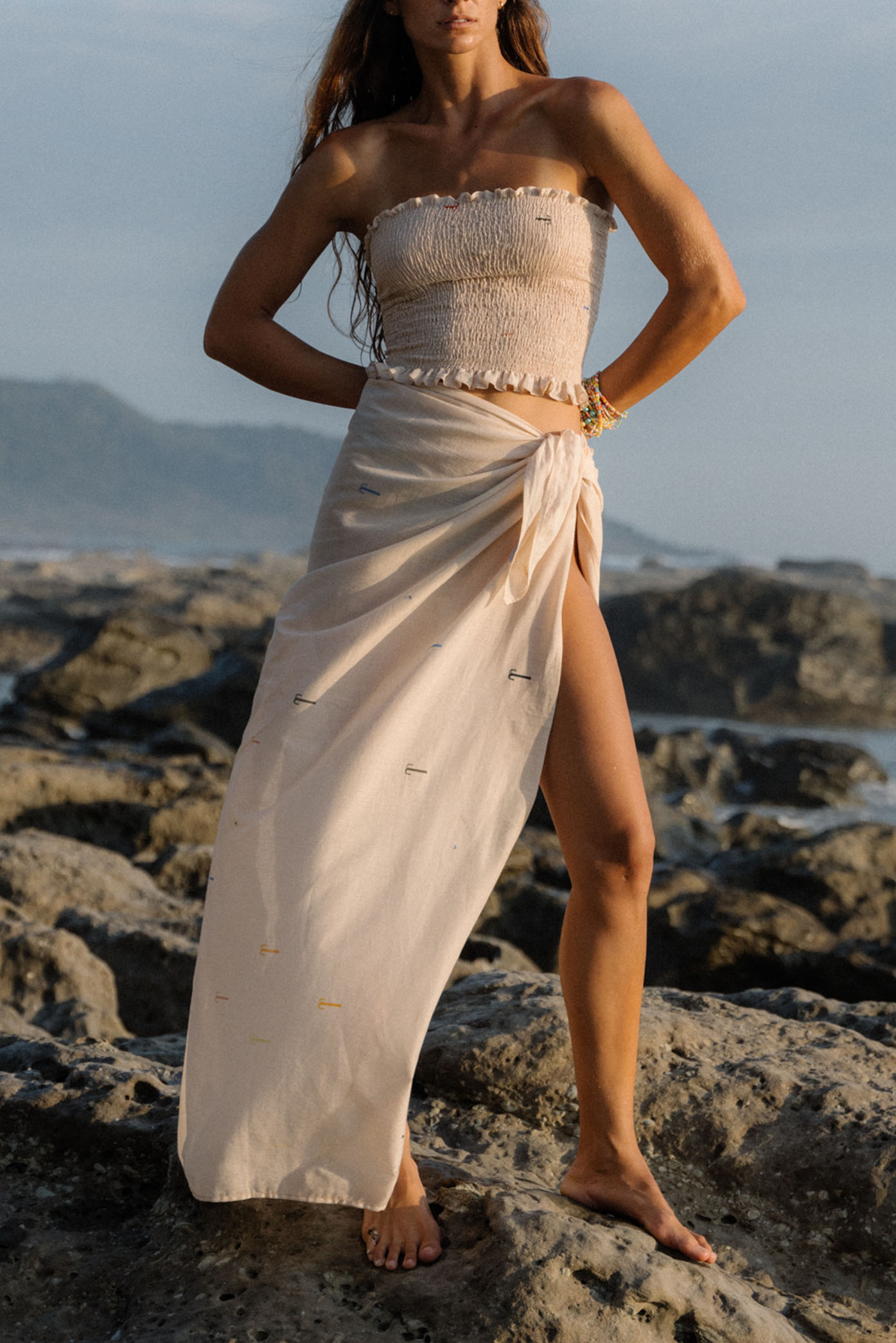 Model wearing the Angel Pareo from the summer 24 Matte collection in a beach in Costa Rica.