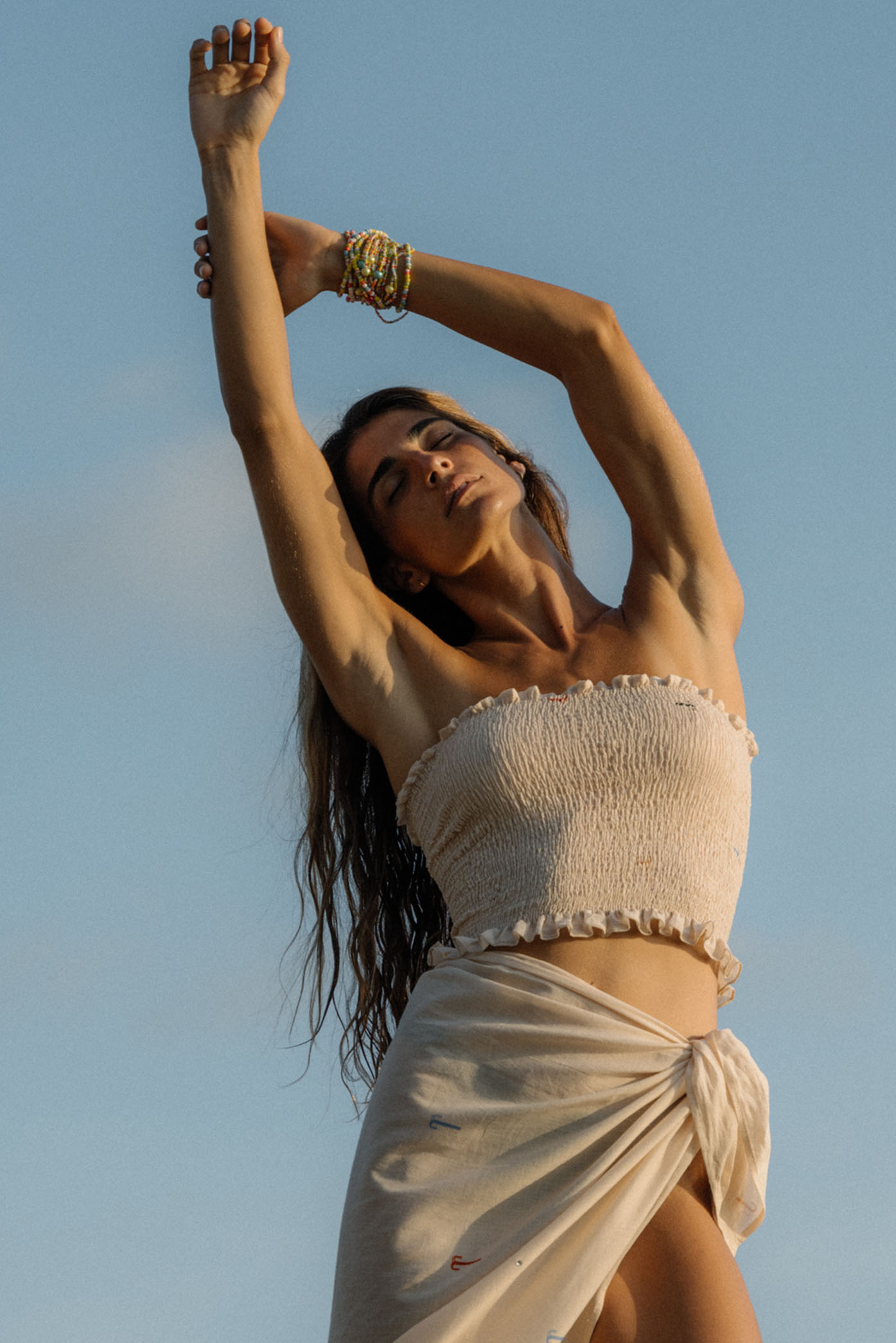 Model wearing the "Angel Top" from the summer 24 Matte collection in a beach in Costa Rica.