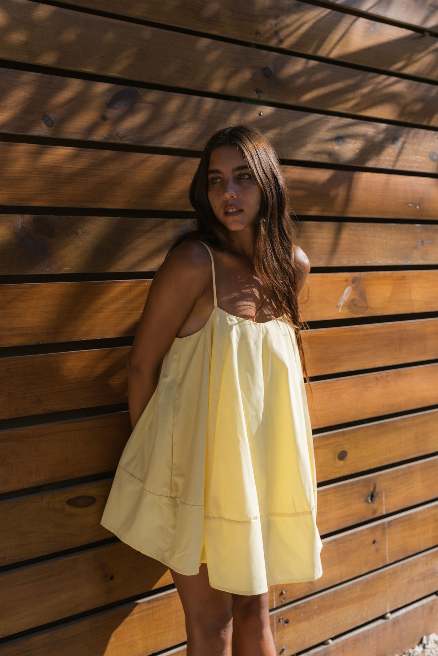 Model wearing the Bubble Mini Dress from the summer 24 Matte collection in a beach in Costa Rica.